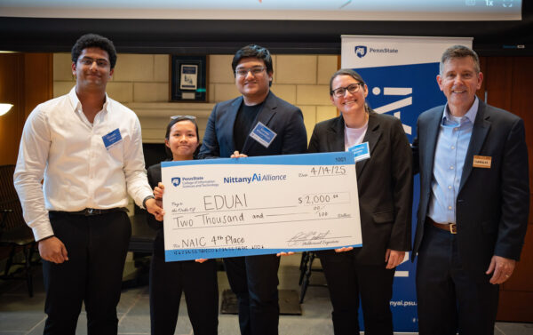 EDUAI team members pose with their award check.