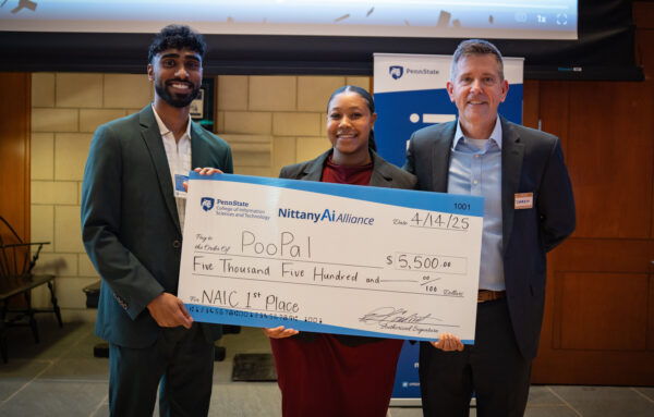 PooPal team members pose with their award check.