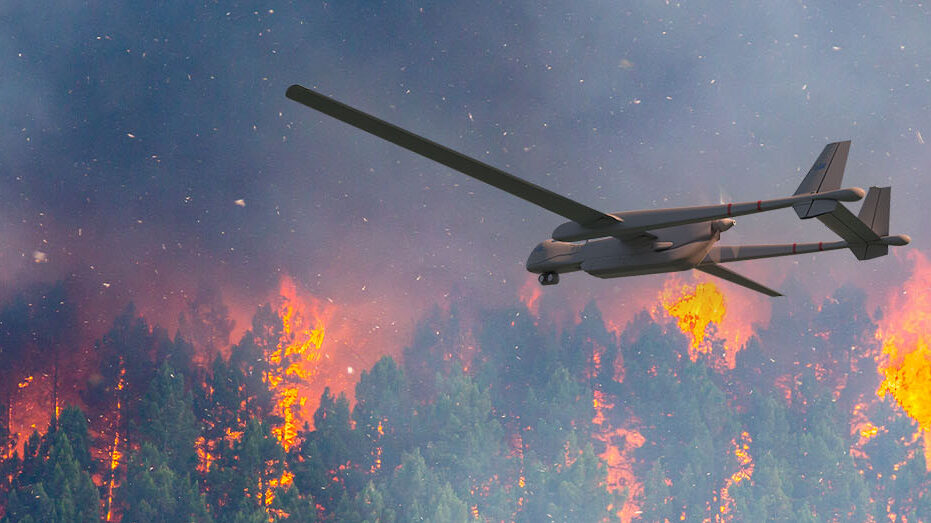 A plane flying low over a wildfire